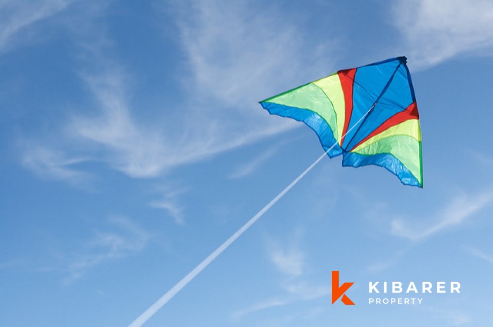 huge kite flying near ngurai rai airport reeled in by