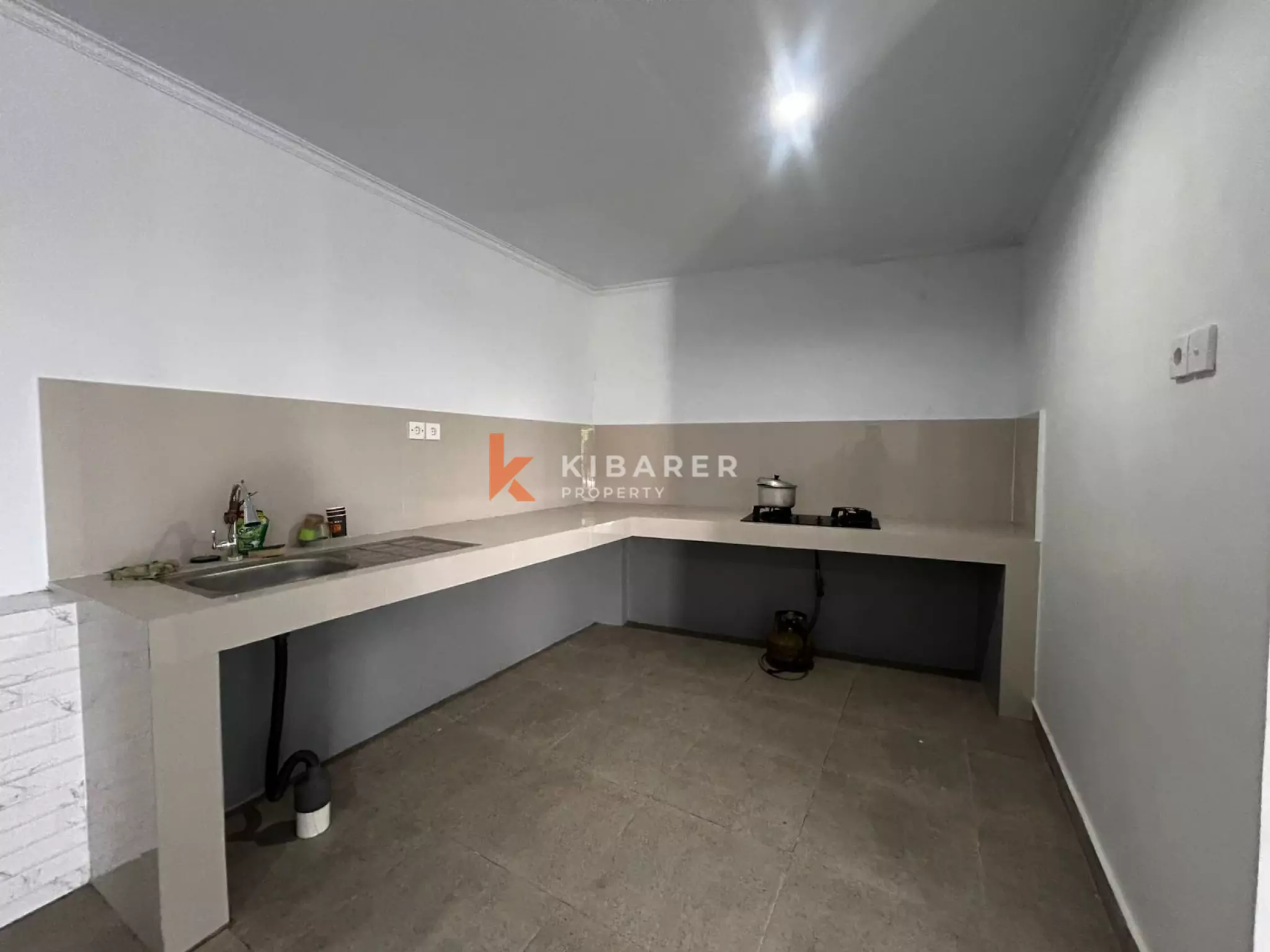 Spacious Four-Bedroom Unfurnished Villa with Open Kitchen and Private Pool in Padonan