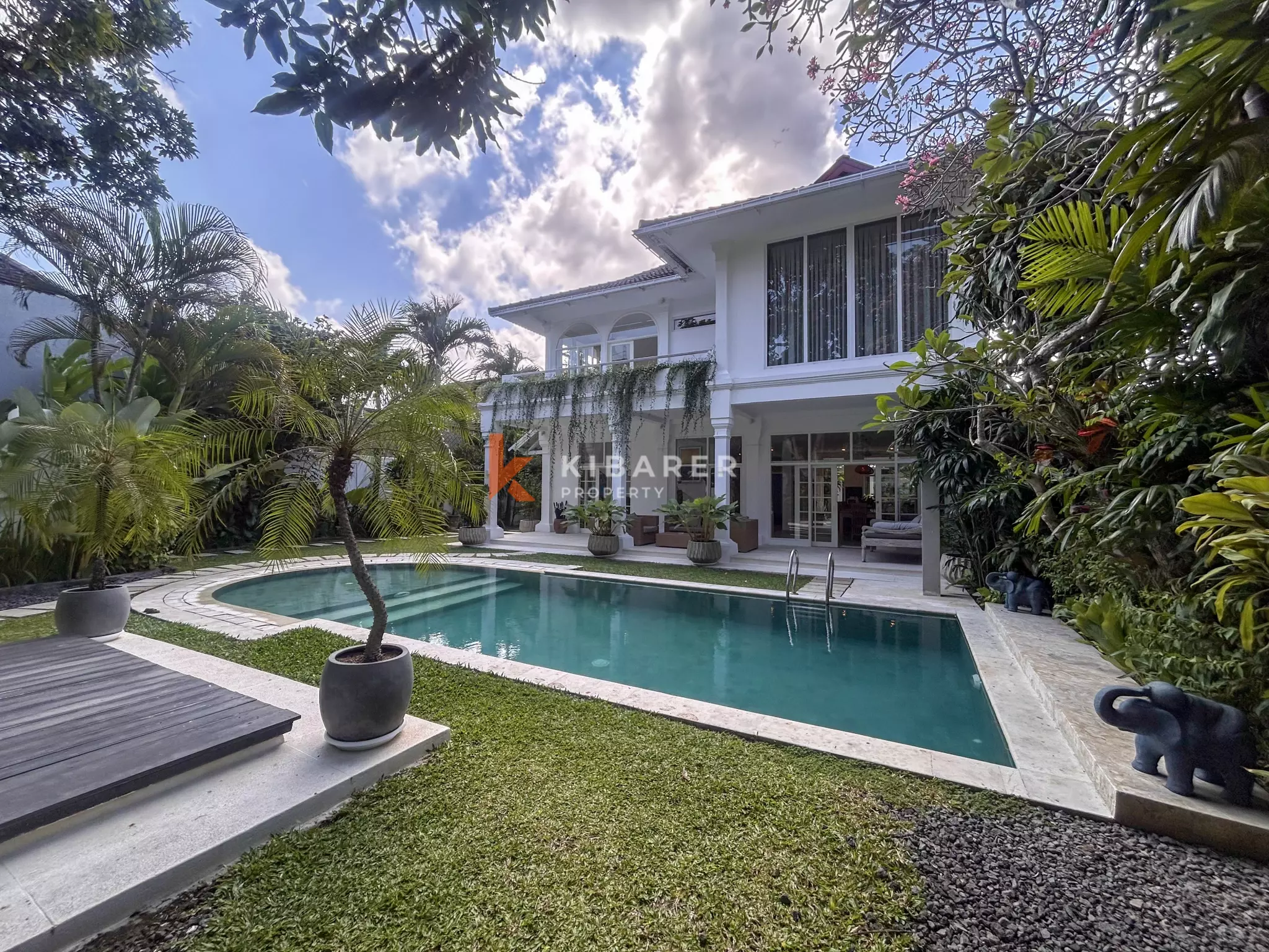 Elegant Four-Bedroom Tropical Villa with Private Pool and Lush Garden in Batu Belig