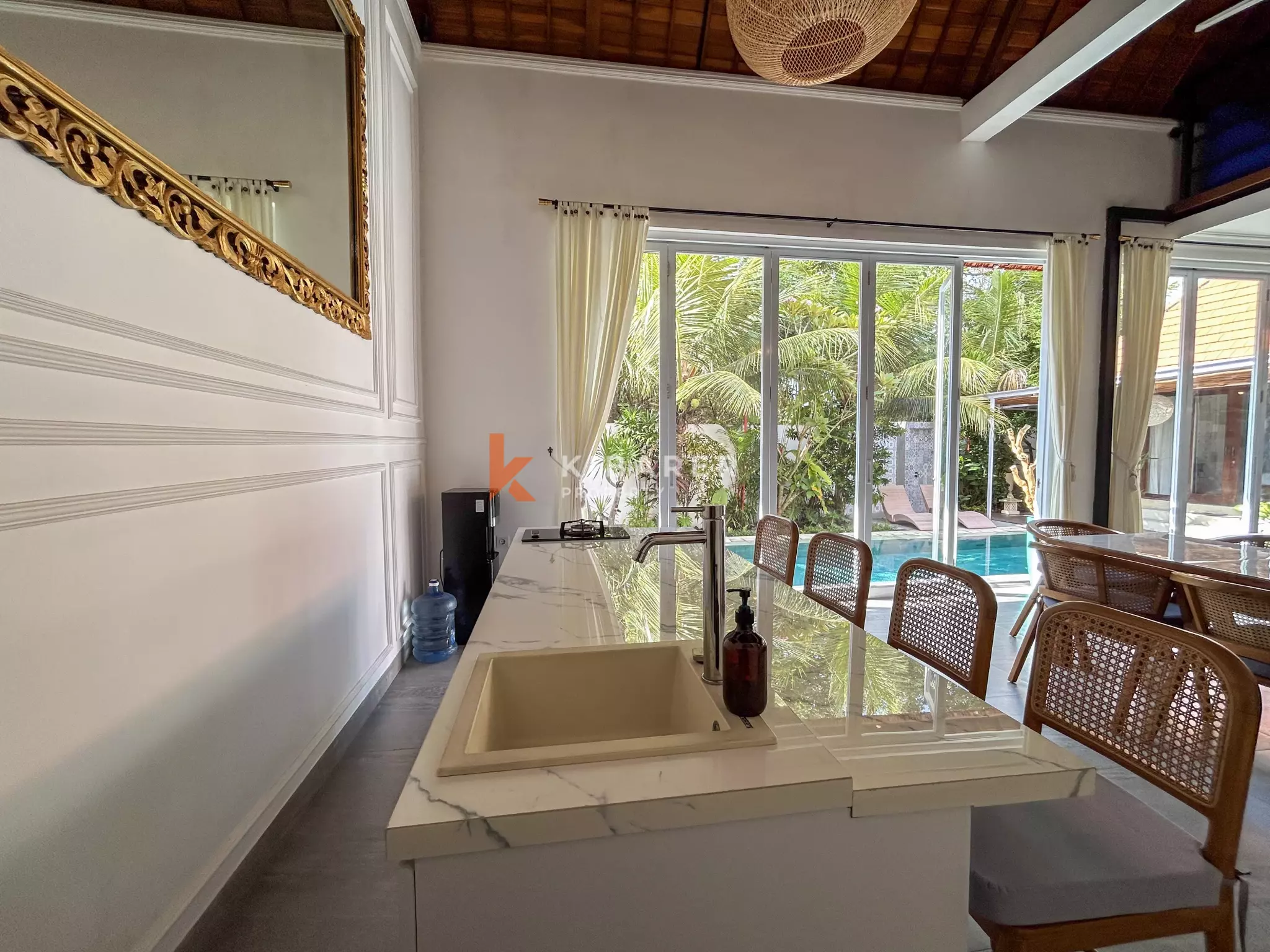 Elegant Four-Bedroom Tropical Pool Villa with Enclosed Living Spaces in Umalas