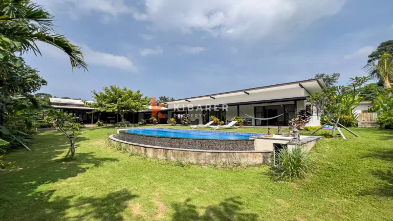 Kedungu Oasis: Elegant Four-Bedroom Villa with Enclosed Living, Pool & Lush Garden