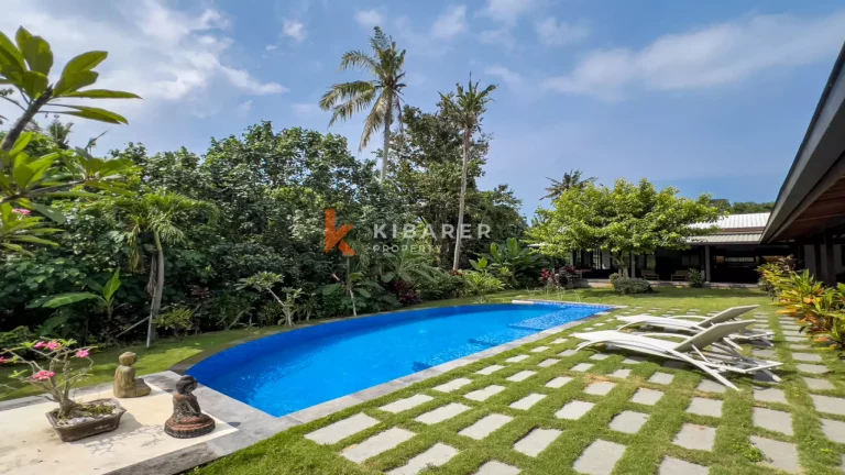 Kedungu Oasis: Elegant Four-Bedroom Villa with Enclosed Living, Pool & Lush Garden