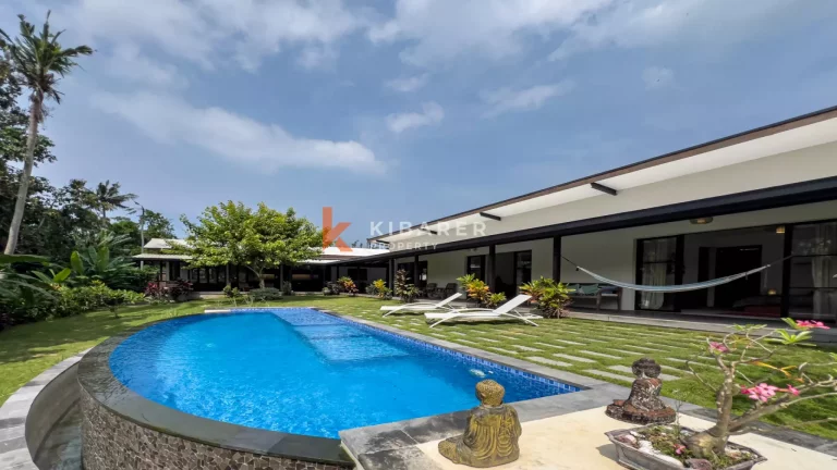 Kedungu Oasis: Elegant Four-Bedroom Villa with Enclosed Living, Pool & Lush Garden