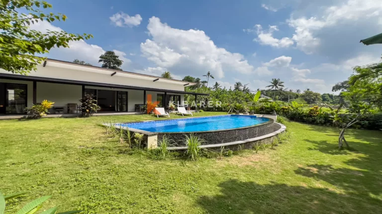 Kedungu Oasis: Elegant Four-Bedroom Villa with Enclosed Living, Pool & Lush Garden
