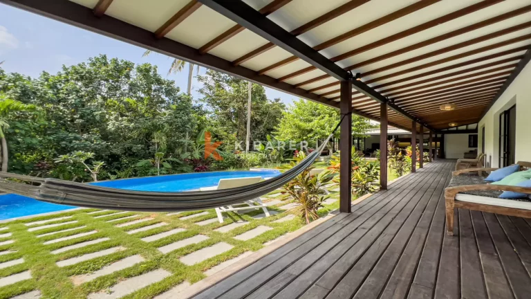 Kedungu Oasis: Elegant Four-Bedroom Villa with Enclosed Living, Pool & Lush Garden